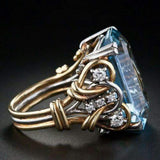 Vintage mehrlagiger Goldring mit blauem Zirkonia