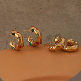 Schimmernde runde Gold-Zirkon-Creolen