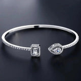 Offenes Gold-Armband mit zwei Steinen